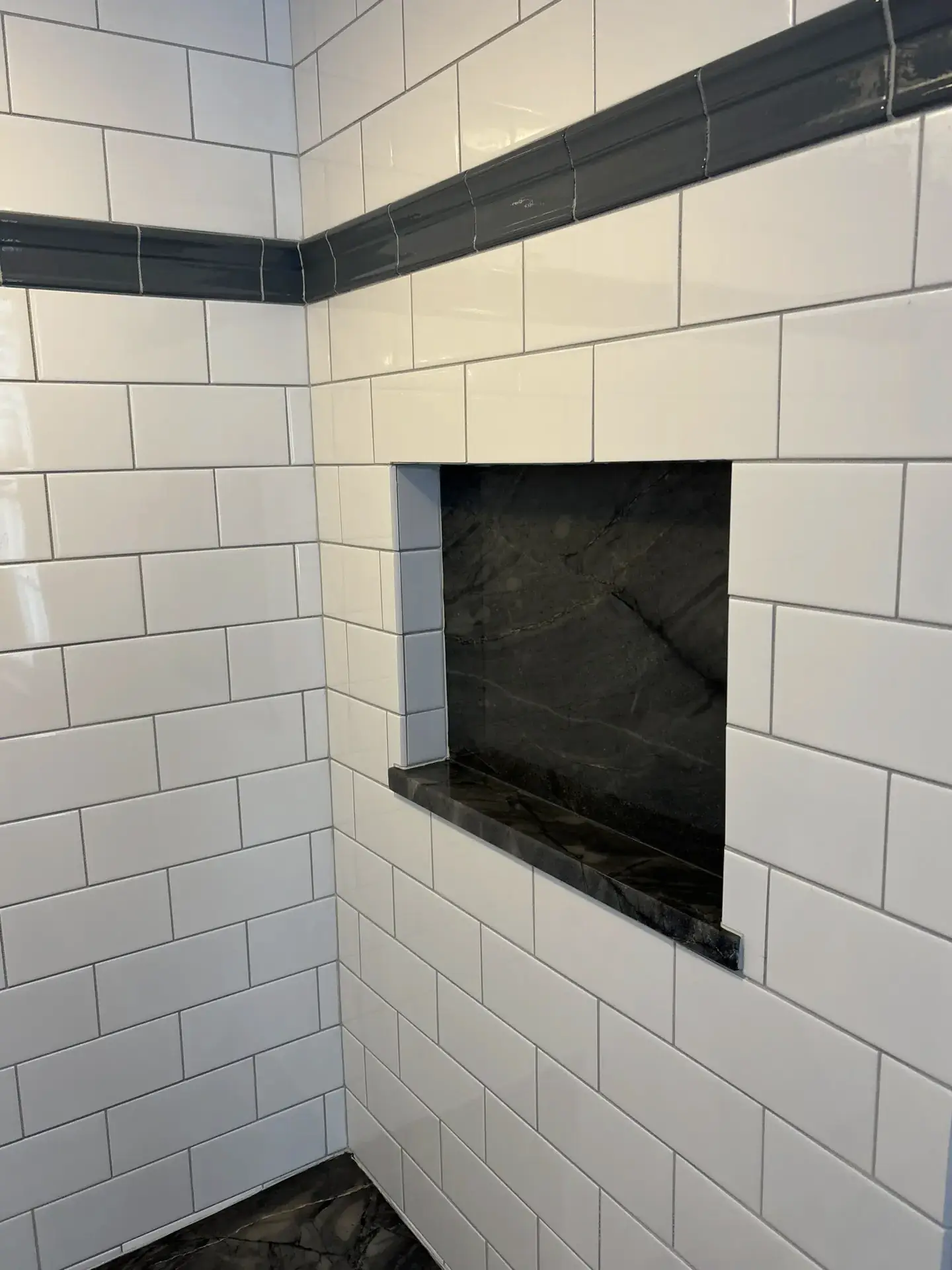 Granite niche detail with pebble floor